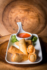 Spring rolls served with a sweet chili dip
