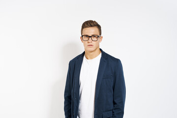 Business man in a jacket wearing glasses manager self-confidence light background