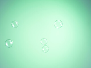 Soap bubbles on green background