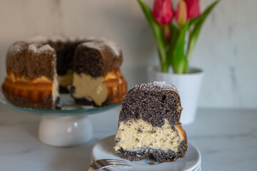 home made poppy seed sponge cake on a table