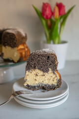 home made poppy seed sponge cake on a table