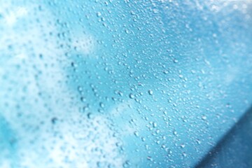 Rain texture drops on blue background