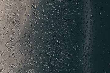 Rain drops on a gray background.