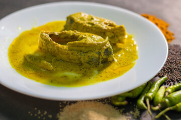 Famous Bengali Dish Hilsa/Ilish fish with poppy and mustard seed recipe.