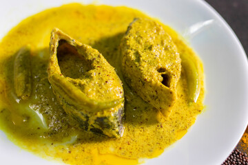 Famous Bengali Dish Hilsa/Ilish fish with poppy and mustard seed recipe.
