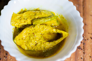 Famous Bengali Dish Hilsa/Ilish fish with poppy and mustard seed recipe.