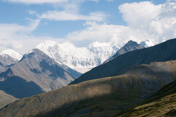 Picturesque view of Altai mountains in summer with snow-covered peak of mountain Belukha in the background, Russian Federation