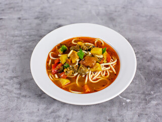 Tomato soup with meat and noodles