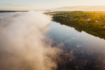 Early morning landscape. Foggy river. River valley in the morning fog at sunrise. View from above. River Volkhov, Russia
