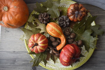 Autumn Background With Pumpkins, Fallen Maple Leaf, Nuts On Wooden Background. Concept Of Thanksgiving Day Background, Halloween Background, Fall Harvest