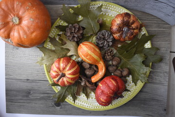 Autumn Background With Pumpkins, Fallen Maple Leaf, Nuts On Wooden Background. Concept Of Thanksgiving Day Background, Halloween Background, Fall Harvest