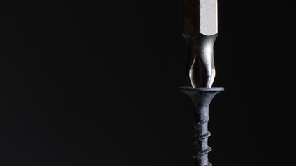 Self-cutters and screwdriver on a black background with space for text. Screw with thread -...