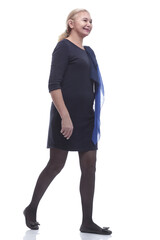 Fototapeta premium in full growth. happy mature woman stepping forward.