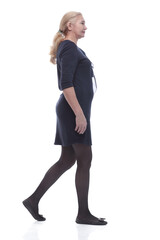 Fototapeta premium side view. confident mature woman stepping forward