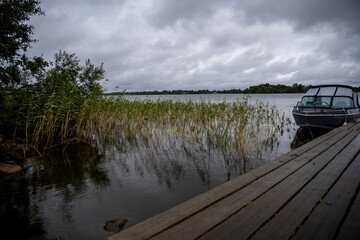 natural landscape of a large lake with boats and navigation signs