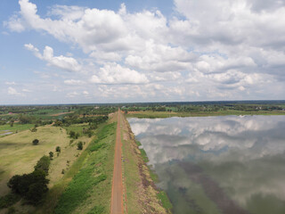 Naklejka premium Drone shot aerial view scenic landscape of river reservoir dam and the forest