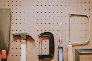 Top view of woodworking tools on pegboard with blank copy space