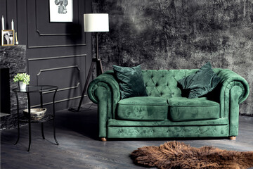 comfortable velvet green sofa in the interior, dark walls, living room, interior design in a classic style, photo studio