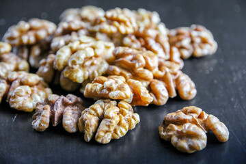 Walnut kernels on a black table