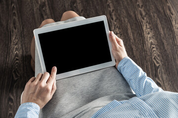 business woman with tablet on her lap