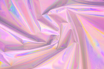 Abstract Modern pastel colored pink holographic background in 80s style. Crumpled iridescent foil...