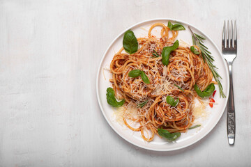 spaghetti bolognese with basil and parmesan