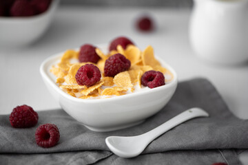 cornflakes with milk and raspberries