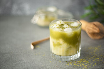 iced green matcha with lemon juice in a glass