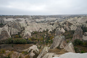 Natural landscape of Cappadocia, semi-arid region in central Turkey known for its distinctive fairy chimneys, tall cone-shaped rock formations clustered in Monks Valley, G&ouml;reme and elsewhere- Kayseri