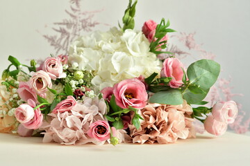 bouquet of delicate roses, eustoma, hydrangea on light background.Flowers composition.Mother's Day, Valentine's Day,birthday. Copy space. I love you concept.Wedding invitation.