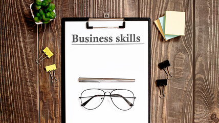 business skills form on a wooden table.