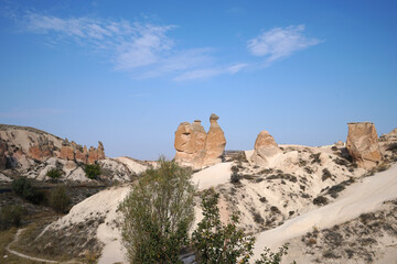 Fototapeta premium Natural landscape of Devrent Valley (Devrent Vadisi) or Imagination valley in Cappadocia, distinctive fairy chimneys, tall cone-shaped rock formations clustered in Monks Göreme- Kayseri, Turkey