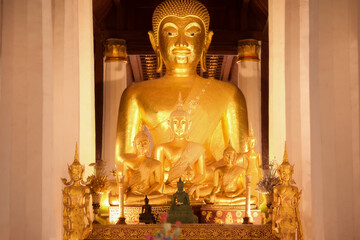 Golden Buddha statue inside the main chapel of wat phra that chae haeng in Nan province.
Thailand