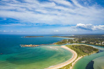 Panoramic aerial view of the beautiful Tomakin Beach and inlet to Tomaga River at Tomakin on the...
