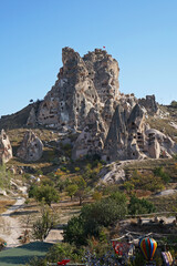 Exterior architecture design of Uchisar castle in Goreme road, tall volcanic-rock outcrop one of Cappadocia's most prominent landmarks and visible for miles around- Turkey