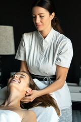 Obraz na płótnie Canvas Healthy woman having massage therapy at spa salon