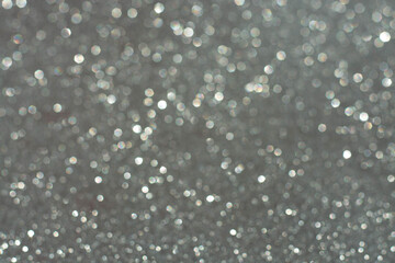 white bokeh abstract on a gray background, the concept of Christmas, new year, 2021.