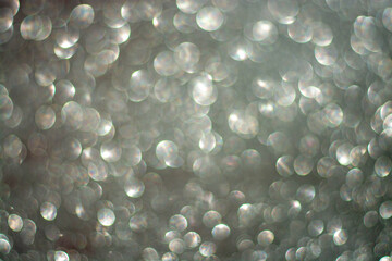 white bokeh abstract on a gray background, the concept of Christmas, new year, 2021.
