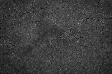 Crack background texture of rough asphalt top view