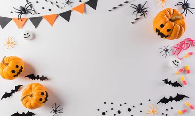 Fototapeten Halloween decorations made from pumpkin, paper bats and black spider on pastel orange background. Flat lay, top view with copy space for text. © Siam