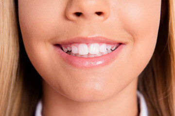 Close up cropped photo of charming lovely schoolgirl little lady mouth pink balm shiny toothy white smile teeth hygiene dentist clinic promo healthy oral care disease prevention concept
