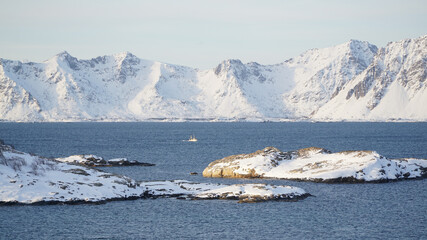 Cold white winter mountain landscapes seen from the Henningsvaer Stadium on the Lofoten Island, Norway.