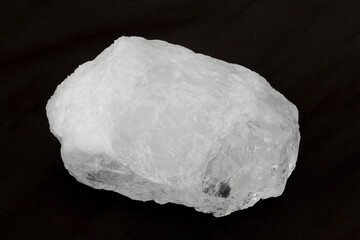 White crystal alum stone isolated on black background.