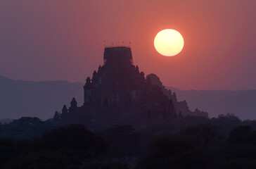 beautiful silhouette landscape view of sunrise over ancient pagoda in Bagan , Myanmar