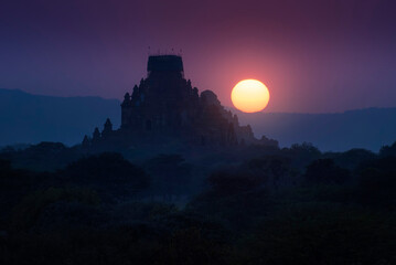 Naklejka na ściany i meble beautiful silhouette landscape view of sunrise over ancient pagoda in Bagan , Myanmar