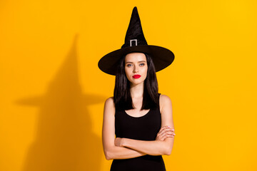 Photo of pretty lovely young sorceress lady folded hands self-assured arrogant look punish curious...