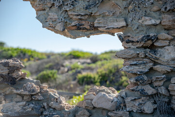 hole in old rock wall