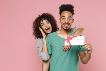 Excited cheerful young african american couple friends guy girl in gray green clothes posing...