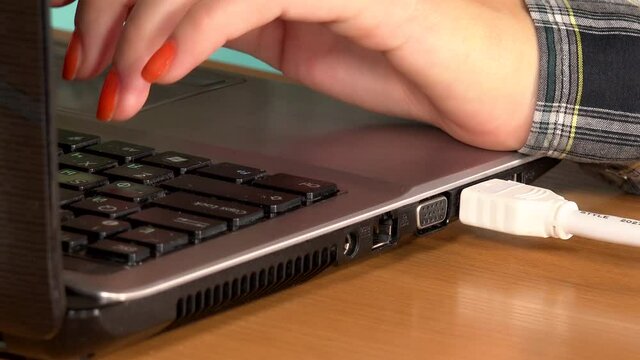 female hand disconnect lan cable while working on computer 4K