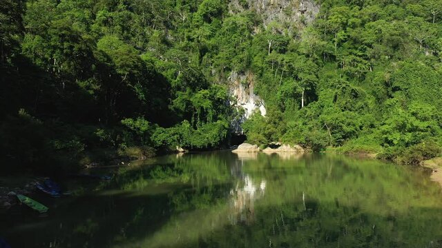 The entrance to the kong Lor cave in the middle of the forest in Asia, Laos, Khammouane, towards Thakek and Konglor, on a sunny day.
